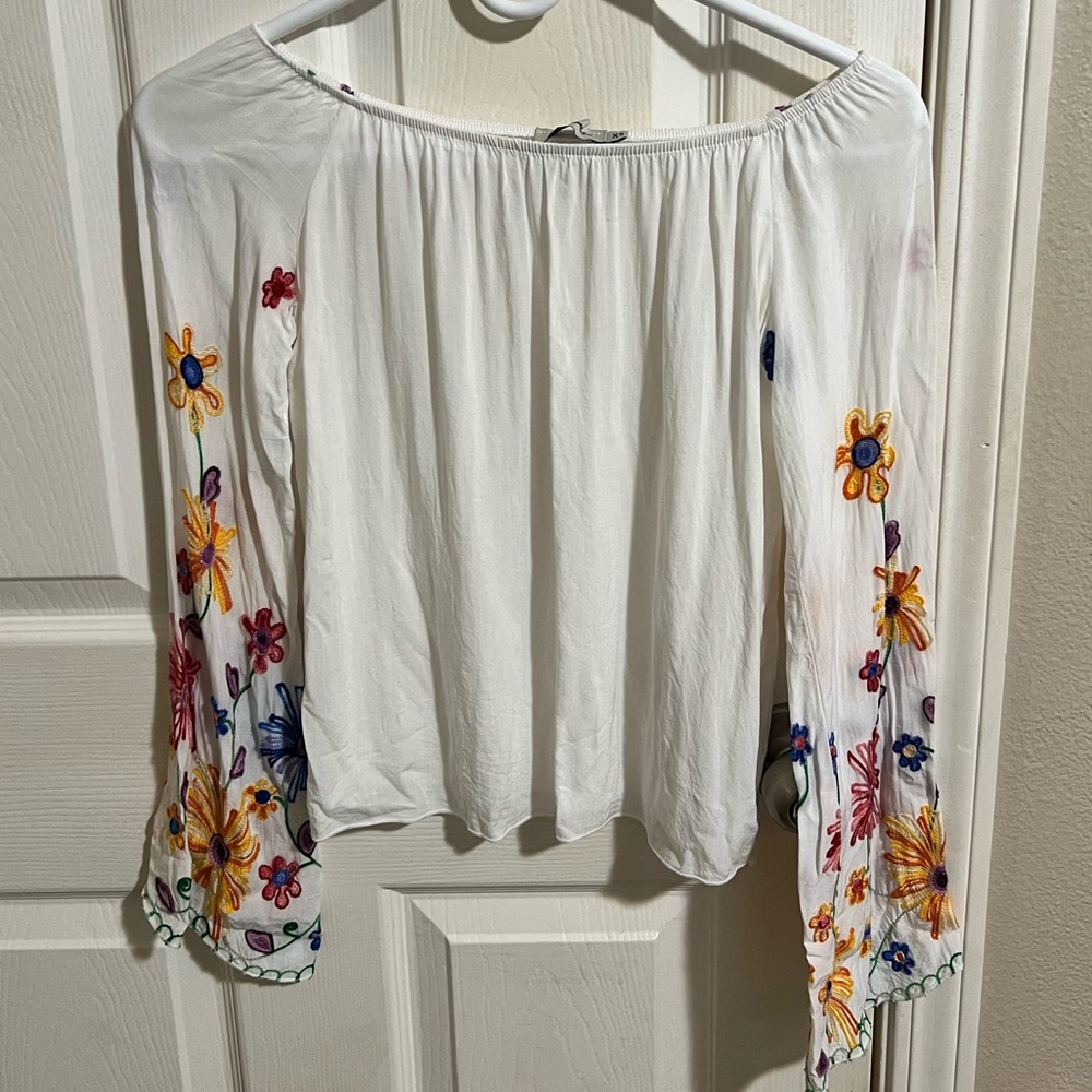 White top with colorful embroidered sleeves